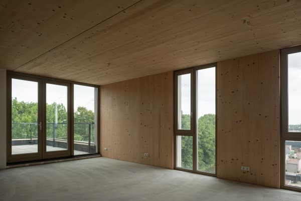 Architectural project - modern apartment, floor to ceiling windows, gray, airy room, balcony view, natural view, patio doors, indoor space, natural materials, eco-friendly design, wood, timber, natural light, glass, neutral tones, daylight, beige, concrete, minimalist vibe, Scandinavian style, neutral palette, minimalist design, cozy space, CLT, cross laminated timber, passive house, contemporary home, clean lines, light filled, large windows, architectural simplicity, beige tones, timber ceiling, timber interior, open plan, warm atmosphere, compact living, nordic influence, modern living, open space, sustainable living, residential interior, wooden walls, wood interior