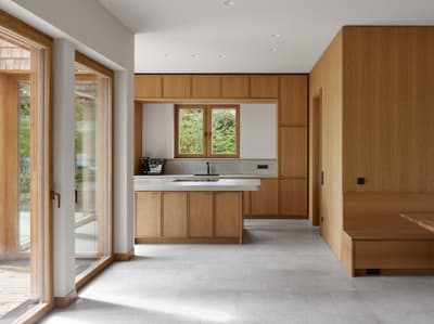 Architectural project - indoor space, natural materials, wood, timber, raw materials, grey, natural light, sustainable design, glass, warm tones, neutral tones, daylight, beige, light wood, eco friendly, simple design, Scandinavian style, minimalist style, neutral palette, glass doors, clean lines, large windows, Nordic design, energy efficient, wood accents, timber accents, home kitchen, open layout, open plan, dining area, inviting space, earthy tones, cozy atmosphere, residential space, minimalist kitchen, modern kitchen, wood cabinetry, timber cabinetry, breakfast nook, sleek design, functional layout, kitchen island, built-in seating, bright space, compact kitchen, practical space, timeless design, calm atmosphere, interior