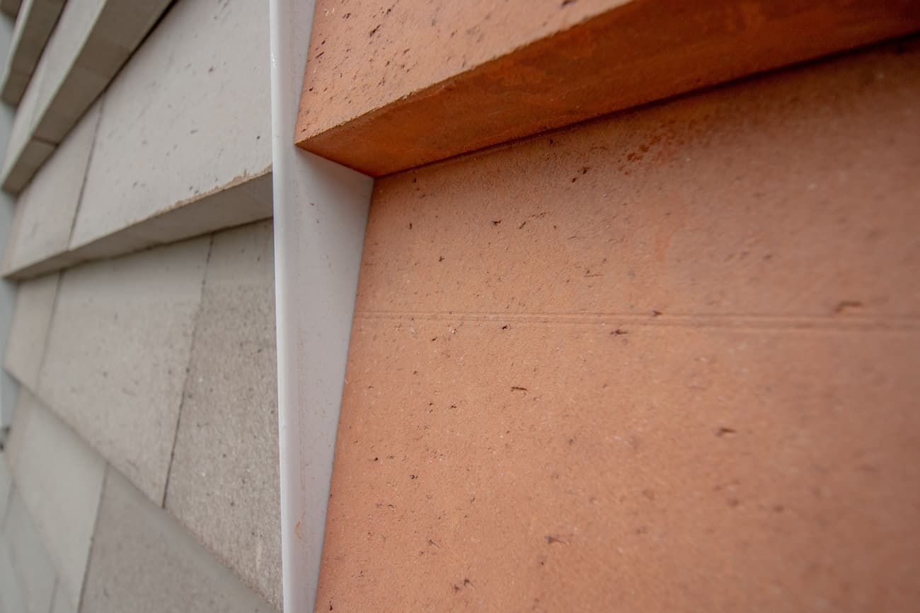 Architectural project - facade, cladding, low carbon materials, material contrast, linear pattern, prefab look, architectural aesthetics, natural materials, architectural detail, sustainable design, warm tones, modular design, sustainable architecture, grey, neutral tones, beige, brown, concrete, exterior wall, industrial style, facade detail, natural textures, architectural texture, contemporary design, sleek lines, industrial touch, minimalist style, minimalist design, eco materials, urban design, geometric design, textured surface, modern facade, clean lines, white, stone, earthy tones, terracotta, sustainable facade, visual interest, cutting-edge design, innovative materials, modern exterior, architectural rhythm, building envelope, exterior cladding, eco facade, architectural innovation