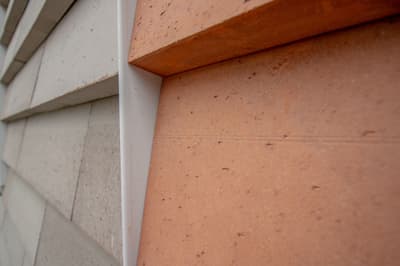 Architectural project - facade, cladding, low carbon materials, material contrast, linear pattern, prefab look, architectural aesthetics, natural materials, architectural detail, sustainable design, warm tones, modular design, sustainable architecture, grey, neutral tones, beige, brown, concrete, exterior wall, industrial style, facade detail, natural textures, architectural texture, contemporary design, sleek lines, industrial touch, minimalist style, minimalist design, eco materials, urban design, geometric design, textured surface, modern facade, clean lines, white, stone, earthy tones, terracotta, sustainable facade, visual interest, cutting-edge design, innovative materials, modern exterior, architectural rhythm, building envelope, exterior cladding, eco facade, architectural innovation