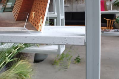 Architectural project - light grey, urban office, collaborative space, contemporary office, natural elements, plant decor, terrazzo finish, terrazzo detail, terrazzo surface, creative workspace, modern office, meeting area, eco-friendly design, wood, grey tones, glass, grey, green, neutral tones, concrete, neutral palette, minimalist design, casual seating, pastel green, industrial chic, greenery, modern furniture, sleek design, interior design, green space, open shelving