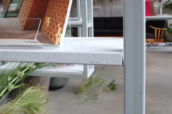 Architectural project - light grey, urban office, collaborative space, contemporary office, natural elements, plant decor, terrazzo finish, terrazzo detail, terrazzo surface, creative workspace, modern office, meeting area, eco-friendly design, wood, grey tones, glass, grey, green, neutral tones, concrete, neutral palette, minimalist design, casual seating, pastel green, industrial chic, greenery, modern furniture, sleek design, interior design, green space, open shelving