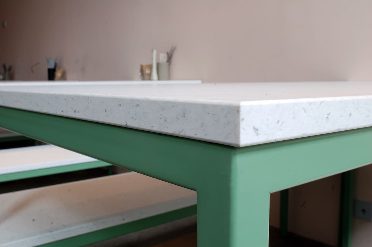 Architectural project - artistic vibe, Scandinavian touch, welcoming atmosphere, terrazzo finish, simple table, social area, minimalist table, design studio, open workspace, matte finish, aesthetic appeal, pastel pink, sustainable materials, recycled materials, eco design, green, neutral tones, functional design, pastel green, creative space, clean lines, white, cozy corner, home office, sleek design, timeless design, modern style, soft tones, modern interior