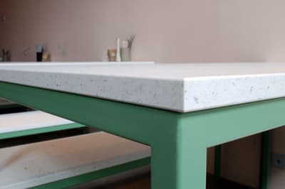 Architectural project - artistic vibe, Scandinavian touch, welcoming atmosphere, terrazzo finish, simple table, social area, minimalist table, design studio, open workspace, matte finish, aesthetic appeal, pastel pink, sustainable materials, recycled materials, eco design, green, neutral tones, functional design, pastel green, creative space, clean lines, white, cozy corner, home office, sleek design, timeless design, modern style, soft tones, modern interior