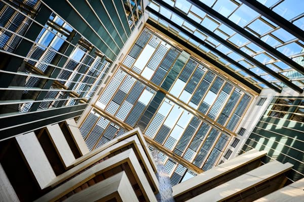 Architectural project - vertical lines, angular design, cool tones, reflective surfaces, glass ceiling, asymmetrical design, eco-friendly design, steel, natural light, shadow play, passive design, sustainable design, glass, sustainable architecture, neutral tones, daylight, industrial vibe, daylight optimization, blue, glass panels, contemporary design, minimalist style, public space, steel structure, geometric design, innovative structure, green architecture, biophilic design, modern facade, large windows, white, modern architecture, energy efficient, airy space, environmental design, bright interior, urban architecture, architectural rhythm, dynamic facade, skylight, atrium, architectural innovation