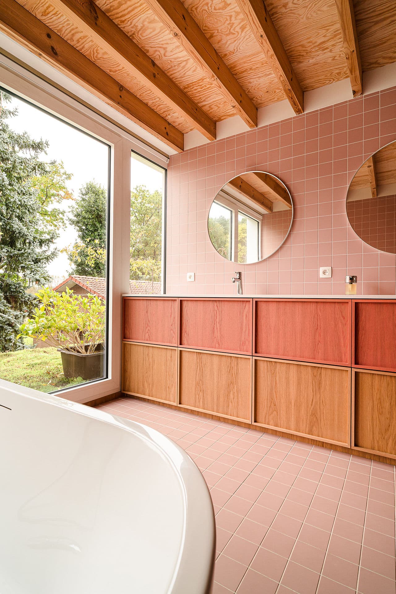 Architectural project - tile, timber cabinets, contemporary bathroom, wooden cabinets, pastel bathroom, round mirrors, wellness space, sustainable materials, pink, wood, timber, natural light, glass, warm tones, natural tones, eco design, exposed beams, daylight, beige, natural wood, eco friendly, simple design, rustic modern, minimalist style, earth tones, modern rustic, large windows, Nordic design, inviting home, timber ceiling, home spa, airy space, inviting space, cozy atmosphere, garden view, bright interior, wood ceiling, calming vibe, tiled wall