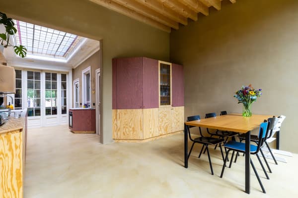 Architectural project - playful interior, dining room, wood furniture, vibrant accents, homey vibe, light wood floor, wooden cabinet, colorful chairs, minimalist table, timber furniture, eclectic seating, simple dining, unique cabinetry, French doors, greenery inside, multicolored chairs, bright decor, rustic flair, purple, indoor space, wood, timber, natural light, sustainable design, glass, neutral tones, exposed beams, daylight, beige, light wood, blue, contemporary touch, natural textures, timber floor, casual gathering, glass doors, modern rustic, eco friendly home, plaster, timber ceiling, warm ambiance, informal dining, open layout, open plan, dining area, inviting space, earthy tones, casual dining, cozy atmosphere, seamless transition, wood ceiling, pastel walls, pendant lamp, home renovation, indoor plants, welcoming home, family-friendly