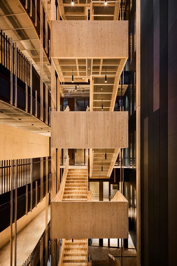 Architectural project - open walkway, golden tones, community building, cultural space, timber texture, layered architecture, structural elegance, natural materials, wood, timber, sustainable design, natural tones, exposed beams, beige, light wood, eco friendly, wood beams, timber beams, contemporary design, minimalist design, timber walls, cross laminated timber, Nordic design, modern architecture, wood walls, timber interior, inviting space, wood texture, warm atmosphere, Scandinavian design, bright interior, interior space, public building, architectural rhythm, warm palette, atrium, high ceiling, double height, wood interior