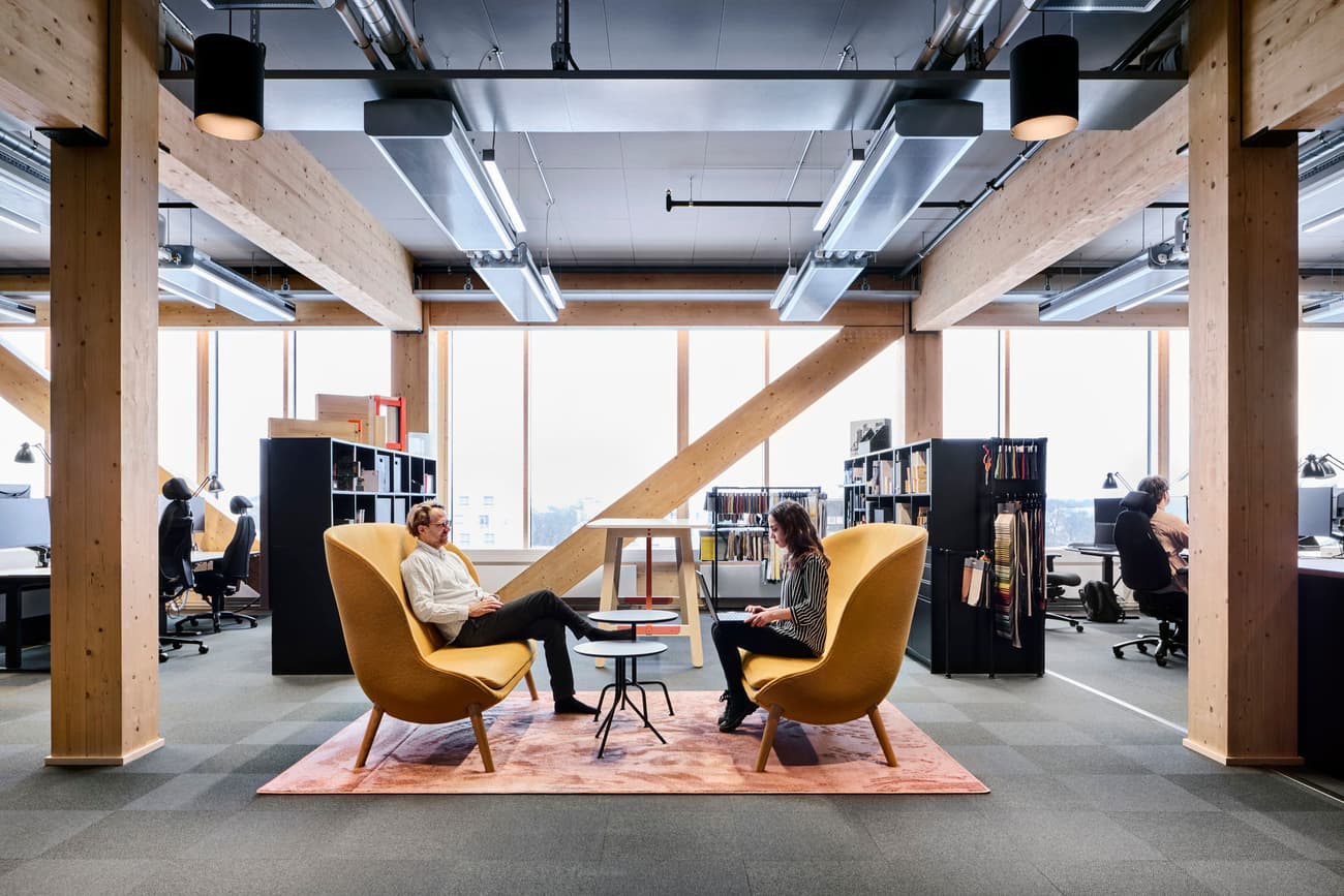 Architectural project - collaborative space, workspace design, ergonomic design, modern office, grey flooring, open office, eco friendly office, meeting area, productive environment, wood, timber, metal, natural light, sustainable design, glass, warm tones, green building, grey, neutral tones, exposed beams, daylight, beige, timber beams, Scandinavian style, wood structure, large windows, Nordic design, open plan, inviting space, warm colors, lounge chairs, bright interior, glass facade