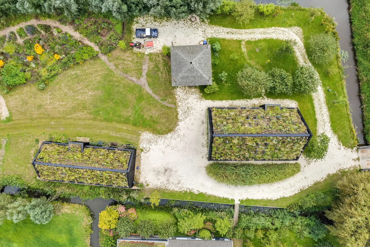 Architectural project - landscape, rural, stone path, vegetation, vegetation roof, garden roof, natural materials, sustainable materials, outdoor space, outdoor living, passive design, sustainable design, natural tones, eco design, green building, sustainable architecture, green, landscape architecture, beige, eco friendly, outdoor, eco home, white, rural home, energy efficient, green living, environmental design, rural setting, landscape design, greenery, barn style, nature integration, natural habitat, integrated design, countryside retreat, gravel path, countryside house, eco retreat, low impact, biodiversity, modern rural, green roof, living roof, aerial view, sustainable living