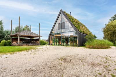 Architectural project - glazed facade, countryside escape, ambient light, modern landscape, modern barn, barn conversion, eco barn, full-height glass, rural getaway, nature blending, natural materials, eco-friendly design, wood, timber, metal, passive design, glass, natural tones, green building, sustainable architecture, green, landscape architecture, beige, brown, natural setting, rural architecture, contemporary touch, rustic modern, rustic charm, modern rustic, biophilic design, open landscape, scenic view, landscape integration, large windows, timber cladding, wood cladding, countryside home, energy efficient, pitched roof, nature-inspired, triangular roof, countryside living, eco retreat, passive solar, seamless indoor outdoor, glass facade, green roof, rural retreat