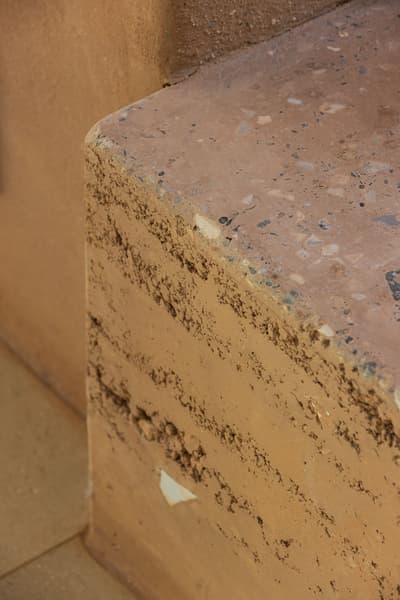 Architectural project - ochre, rough surface, organic finish, warm color palette, earthen texture, ochre tones, texture rich, earthy aesthetic, natural materials, organic texture, warm tones, eco design, sustainable construction, green building, sustainable architecture, eco friendly, eco structure, rustic vibe, natural finish, natural building, rammed earth, earthen wall, natural material, raw texture, earth tones, earth construction, biophilic design, textured surface, rustic finish, textured wall, rough texture, earthy tones, natural texture, terracotta, rustic wall, environmentally friendly, sustainable material, clay wall, earthy colors, warm aesthetic