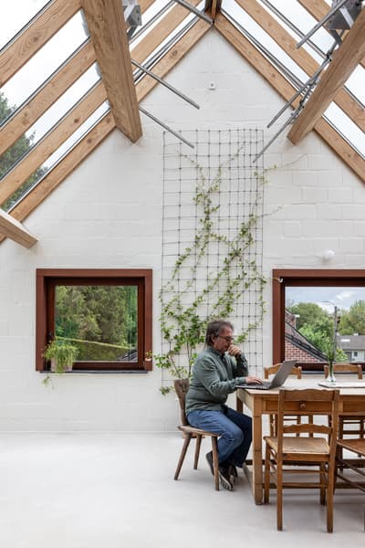 Architectural project - airy interior, skylights, cozy workspace, home workspace, loft office, eco workspace, modern farmhouse, minimalist workspace, rustic furniture, white interior, personal office, workspace inspiration, eco-friendly design, sustainable materials, wood, timber, natural light, rustic touch, passive design, recycled materials, glass, neutral tones, exposed beams, daylight, beige, concrete, light wood, wooden beams, timber beams, Scandinavian style, neutral palette, creative space, wood structure, biophilic design, sustainable home, contemporary home, white walls, indoor outdoor, white, energy efficient, plaster, open plan, nature-inspired, tranquil vibe, garden view, green design, home office, bright space, Nordic vibes, wooden furniture, home retreat, indoor plants, vaulted ceiling