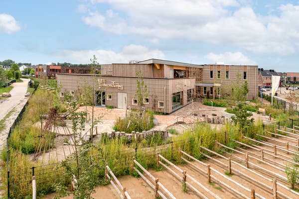 Architectural project - airy structure, landscaped garden, environmental focus, eco-friendly landscape, plant-filled exterior, eco playground, grid design, architectural grid, open environment, environmental planning, outdoor classroom, eco exterior, natural materials, sustainable materials, wood, timber, natural light, passive design, sustainable design, recycled materials, warm tones, green building, outdoor area, green, timber structure, daylight, beige, wood facade, timber facade, low carbon design, community center, eco construction, natural landscape, green architecture, earth tones, biophilic design, timber cladding, wood cladding, harmonious design, energy efficient, nature-inspired, landscape design, nature integration, eco architecture, educational building, green roof, outdoor learning, modern school