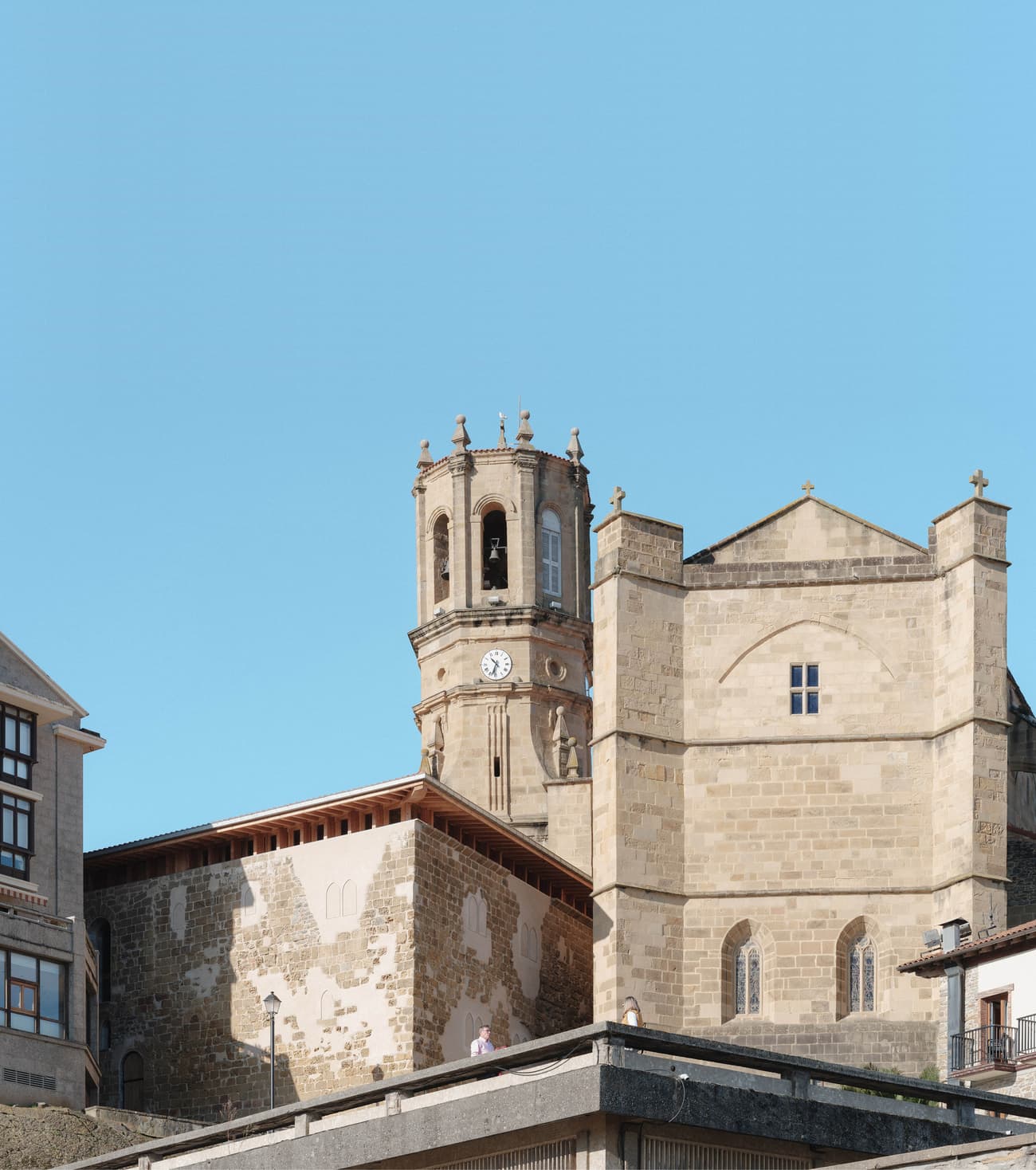 Architectural project - stone facade, light stone, stone masonry, masonry work, historic building, cultural heritage, historic preservation, arched windows, city view, architectural heritage, classic design, masonry, heritage site, cultural landmark, medieval style, historic charm, skyline view, picturesque view, vintage architecture, historic skyline, architectural detail, urban landscape, grey, neutral tones, beige, rustic charm, blue sky, stone, traditional architecture, exterior view, sky view, stone texture