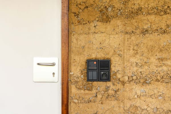 Architectural project - contrast design, modern touch, minimalist door, rustic appeal, earthy finish, white door, rustic vibes, neutral design, mud wall, natural materials, sustainable design, beige, brown, eco friendly, simple design, black, neutral colors, natural finish, rammed earth, modern rustic, white, textured wall, plaster wall, beige tones, rustic style, earthy tones, warm atmosphere, rustic design, handcrafted look, rustic wall, earthy textures, clay wall, low-tech, sustainable living, warm palette, warm aesthetic, minimalistic style, natural look