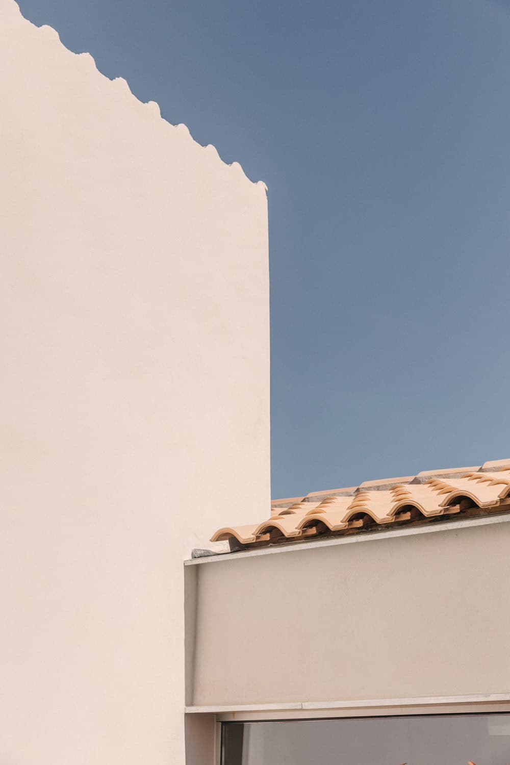 Architectural project - southern style, structural simplicity, terracotta roof, roofline, mediterranean home, mediterranean design, stucco wall, home exterior, villa design, minimal design, architectural detail, coastal style, rustic touch, passive design, sustainable design, neutral tones, beige, minimalist facade, eco friendly, simple design, outdoor, facade detail, exterior, blue sky, geometric design, natural palette, modern minimalism, clean lines, white facade, white, modern architecture, plaster wall, clay, Mediterranean style, warm climate, terracotta, residential design, sunny day, traditional roofing, Mediterranean vibe, timeless design, organic shapes, clay tiles