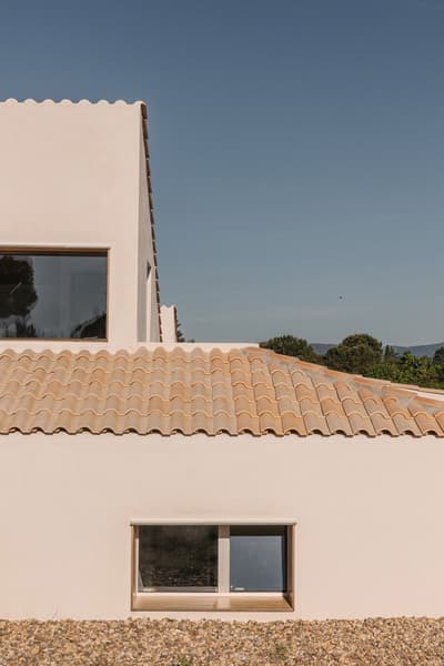 Architectural project - roof tiles, countryside style, tile roof, modern Mediterranean, home exterior, mediterranean house, stucco, arched window, natural stones, gravel landscape, seamless exterior, sustainable materials, summer house, natural light, glass, warm tones, eco design, spacious layout, beige, flat roof, sunlight, rural architecture, simple design, outdoor, private retreat, minimalist design, passive cooling, exterior, tranquil setting, modern rustic, contemporary home, landscape integration, clean lines, white facade, elegant design, bright exterior, white, large window, stone, beige tones, terracotta, vacation home, residential building, timeless design, minimalistic, airy feel