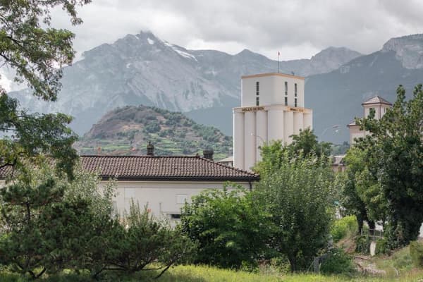 Architectural project - rural landscape, eco-friendly area, cloudy sky, roof tiles, calm surroundings, outdoor environment, historic building, peaceful view, mountain backdrop, vegetated area, local vegetation, outdoor landscape, village scene, picturesque view, idyllic setting, rural homes, nature surrounds, quiet living, scenic retreat, scenic mountains, community area, village life, neighborhood setting, forested area, picturesque landscape, outdoor space, rural architecture, rustic vibe, rustic charm, traditional building, serene atmosphere, scenic view, tranquil vibe, greenery, natural environment, nature escape, countryside living, peaceful living, lush greenery, greenery view, residential area, sustainable living, nature setting, natural beauty