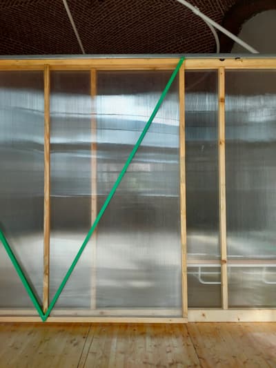 Architectural project - flexible space, sustainable, room divider, modern loft, exposed brick, structural simplicity, arched ceiling, curved ceiling, warm floor, architectural detail, eco-friendly design, sustainable materials, wood, timber, industrial design, wooden frame, timber frame, natural light, warm tones, natural tones, modular design, eco design, sustainable architecture, neutral tones, translucent panels, polycarbonate, beige, light wood, simple design, contemporary design, wooden floor, translucent wall, open framework, adaptive reuse, lightweight structure, adaptable space, green architecture, clean lines, minimalist space, innovative materials, soft light, modern interior, natural, warm