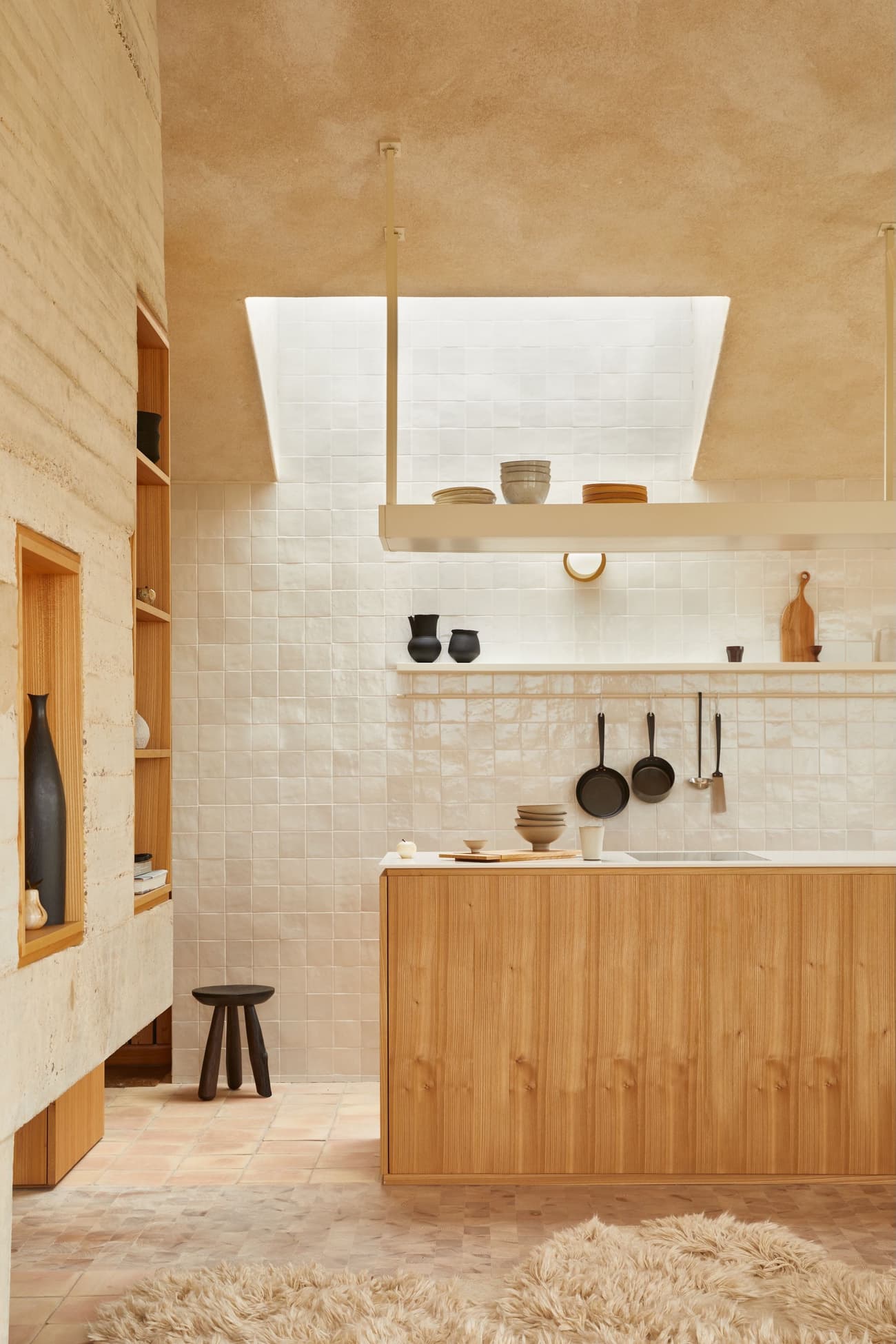Architectural project - natural materials, wood, relaxed vibe, natural light, warm tones, eco design, neutral tones, functional space, daylight, beige, light wood, simple design, honey wood, rustic modern, Scandinavian style, neutral palette, calming space, modern rustic, sustainable home, light filled, white, plaster, cozy kitchen, open shelves, open plan, inviting space, minimalist decor, earthy tones, terracotta, textured walls, minimalist kitchen, plaster walls, comfortable living, interior design, terracotta floor, wooden cabinetry, kitchen, Japandi style, ceramic, warm kitchen, skylight, tiled wall, ceramic tiles, floating shelves, wood counter, pendant lamp, airy kitchen, spacious feel, home renovation
