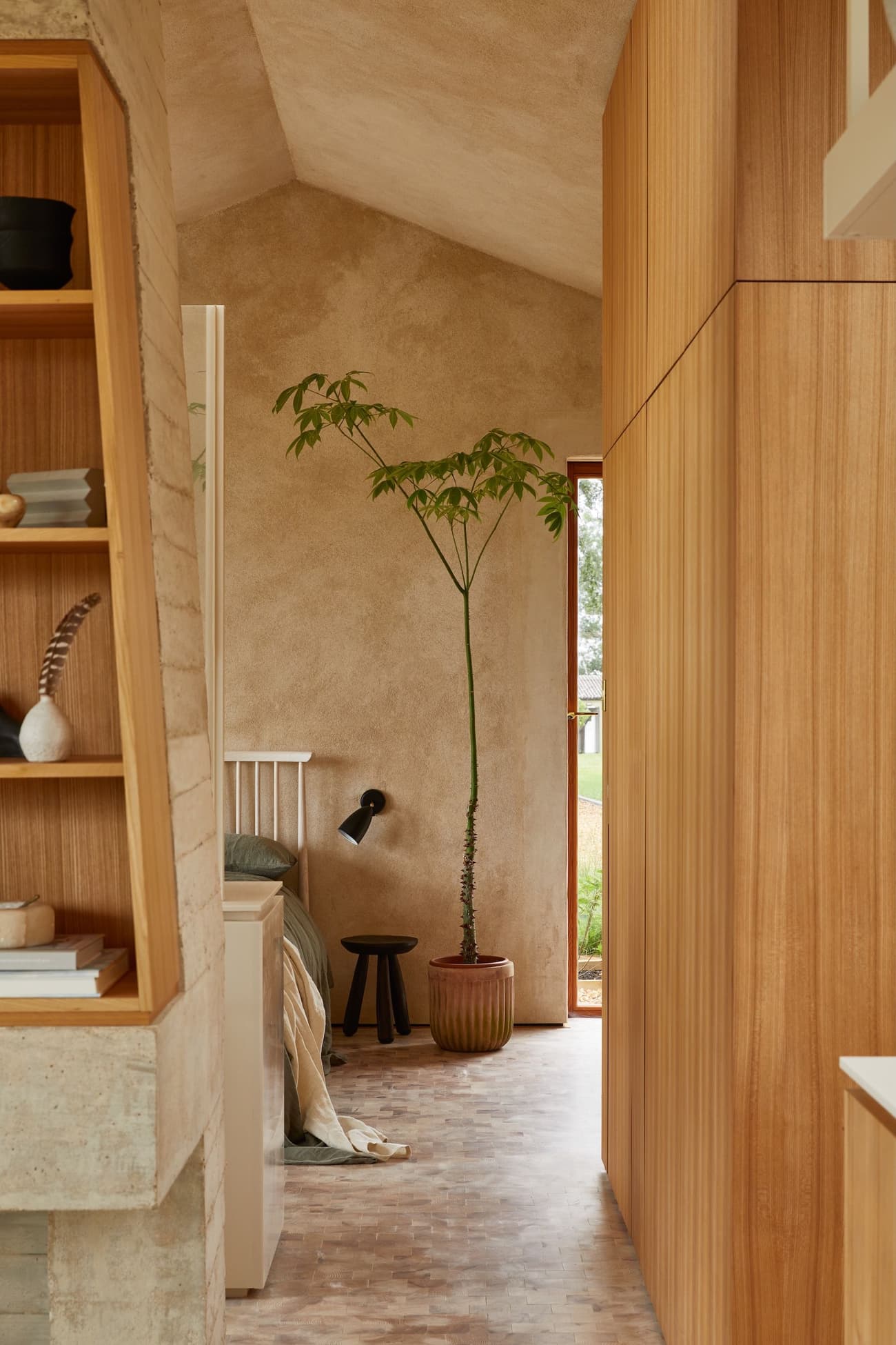 Architectural project - cozy interior, intimate space, calming atmosphere, soft lighting, wood, timber, natural light, sustainable design, contemporary style, neutral tones, beige, light wood, rustic modern, natural textures, light brown, tranquil setting, timber walls, modern rustic, simple elegance, eco friendly home, harmonious design, textured wall, plaster wall, plaster, beige tones, cozy nook, open shelves, airy space, inviting space, earthy tones, quiet retreat, Nordic vibe, Scandinavian design, modern home, functional layout, minimal decor, built-in shelving, serene home, natural home, warm palette, wooden paneling, indoor plant, parquet flooring, bedroom corner, wood finishes, relaxing ambiance, live plant, pottery decor, design simplicity, green plant