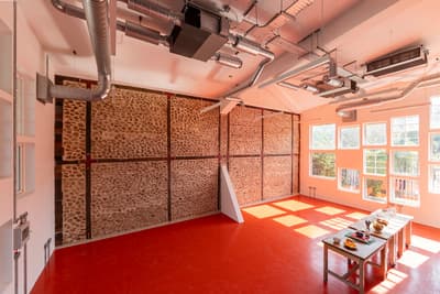Architectural project - grid windows, workshop, bright red, innovative space, industrial interior, loft style, raw aesthetic, modern workspace, red flooring, red floor, exposed stone, exposed ducts, open ductwork, industrial loft, creative studio, workspace design, office interior, modern elements, eclectic vibe, studio style, mix materials, unfinished look, contemporary office, flexible layout, urban loft, raw materials, steel, natural light, rustic touch, glass, eco design, steel beams, concrete, industrial elements, functional design, daylight optimization, steel structure, urban design, vibrant space, industrial chic, creative space, workspace, large windows, textured wall, stone, open plan, stone wall, bright interior, airy atmosphere, interior design, sustainable interior, architectural space, red