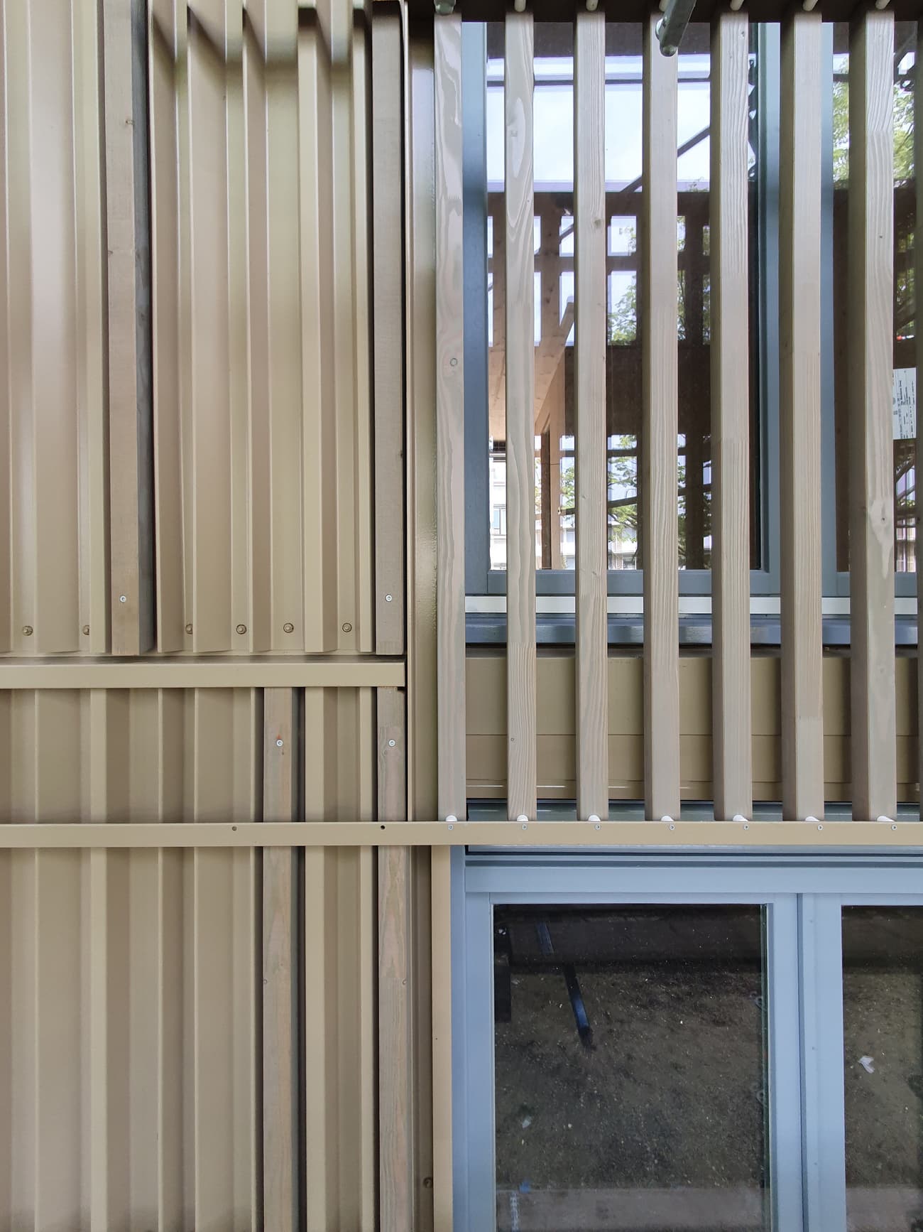 Architectural project - facade, metal accents, outdoor facade, building exterior, minimal design, natural materials, architectural design, sustainable materials, wood, timber, natural light, glass, warm tones, eco design, daylight, beige, building facade, architectural facade, geometric pattern, light wood, natural wood, eco friendly, sunlight, honey wood, contemporary design, neutral palette, exterior, urban design, structural detail, building materials, green architecture, biophilic design, modern facade, clean lines, timber cladding, wood cladding, modern architecture, sustainable facade, honey tones, wooden slats, innovative facade, vertical slats, architectural rhythm, texture contrast