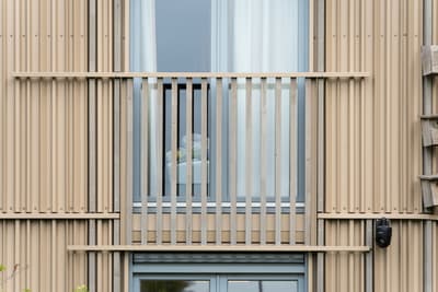 Architectural project - facade, beige facade, rhythmic pattern, linear design, modern apartment, urban dwelling, vertical lines, curtain, minimal design, architectural detail, sustainable design, warm tones, eco design, contemporary style, neutral tones, wood facade, timber facade, exterior design, geometric pattern, light wood, daylight optimization, exterior, modern aesthetics, natural material, low carbon, natural ventilation, modern facade, clean lines, timber cladding, wood cladding, energy efficient, warm beige, wood slats, vertical cladding, vertical slats, facade texture, architectural rhythm, window detail, sustainable living, residential facade