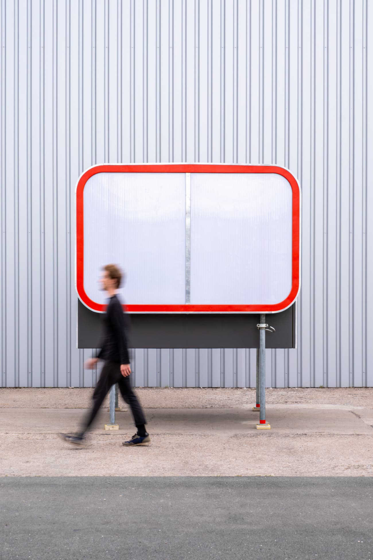Architectural project - metal structure, urban art, public art, modern installation, colorful installation, interactive installation, minimalist sculpture, urban structure, plexiglass, transparent panel, red outline, bright red, industrial backdrop, street art, city installation, exposed materials, innovative art, artistic feature, pedestrian area, urban creativity, bold statement, eye-catching art, outdoor gallery, modern sculpture, design element, public engagement, city art, creative installation, sustainable design, urban landscape, innovative design, industrial setting, modern aesthetic, outdoor structure, contemporary design, public space, steel frame, geometric design, clean lines, sleek design, modern urban, architectural feature, urban vibe, pop of color