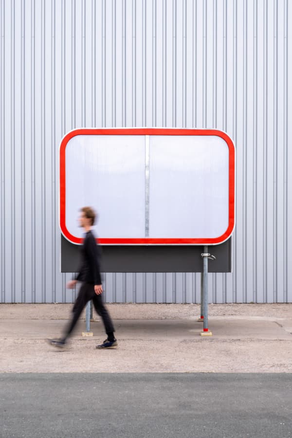 Architectural project - metal structure, urban art, public art, modern installation, colorful installation, interactive installation, minimalist sculpture, urban structure, plexiglass, transparent panel, red outline, bright red, industrial backdrop, street art, city installation, exposed materials, innovative art, artistic feature, pedestrian area, urban creativity, bold statement, eye-catching art, outdoor gallery, modern sculpture, design element, public engagement, city art, creative installation, sustainable design, urban landscape, innovative design, industrial setting, modern aesthetic, outdoor structure, contemporary design, public space, steel frame, geometric design, clean lines, sleek design, modern urban, architectural feature, urban vibe, pop of color