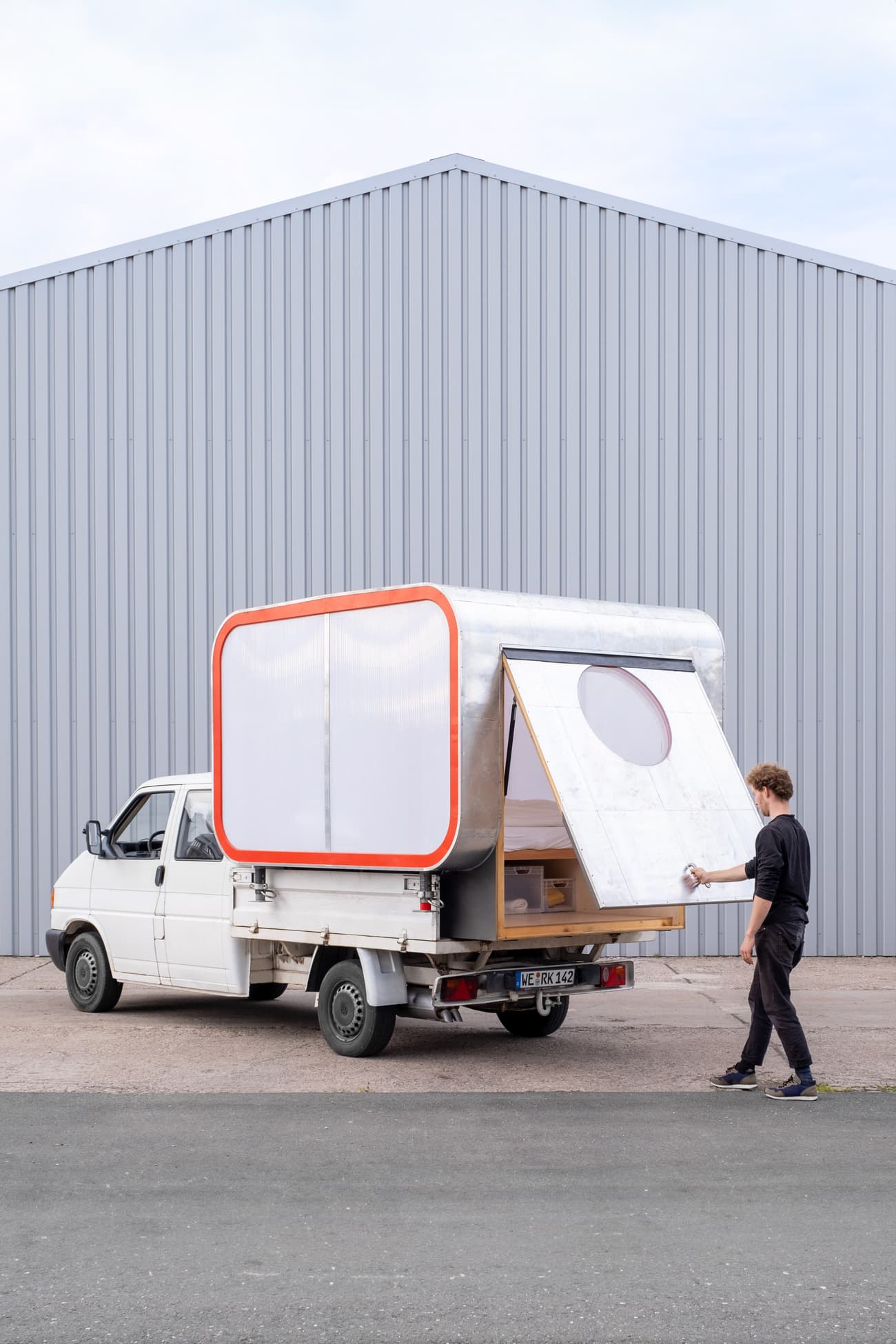 Architectural project - adventure vehicle, nomadic lifestyle, eco travel, flexible living, travel lifestyle, road trip, minimalist lifestyle, micro home, modern caravan, urban camping, pop up camper, sustainable travel, outdoor adventure, mobile dwelling, movable shelter, transportable house, prefab structure, minimalist home, urban mobility, compact vehicle, aluminum exterior, bright accents, mobile office, functional minimalism, flexible architecture, tiny cabin, steel, modular design, innovative design, grey, functional space, modern aesthetic, contemporary design, portable design, lightweight structure, orange, white, modular home, off-grid living, compact living, aluminum, innovative architecture, compact home, small footprint, tiny home, efficient space