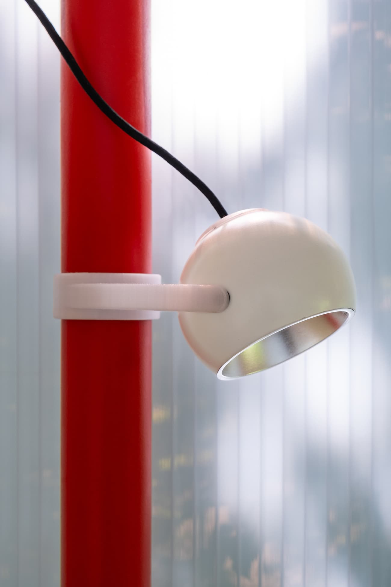 Architectural project - space-saving, bright red, design element, modern lamp, contemporary light, sleek lamp, red pole, white lamp, modern decor, interior lighting, accent light, stylish lamp, metal lamp, metal finish, indoor light, soft glow, ambient light, retro vibe, art deco, geometric shape, cylindrical pole, tubular pole, creative lighting, artistic light, trendy decor, home decor, office light, accent decor, simple aesthetic, compact light, LED light, sustainable design, glass, functional design, industrial touch, minimalist design, clean lines, white, energy efficient, aluminum, curved design, unique lamp, reading lamp, red