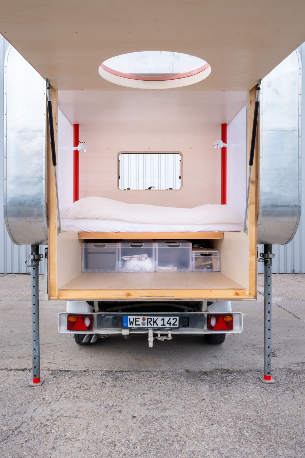 Architectural project - portable dwelling, camper van, mobile home, modern camper, road trip, nomadic living, camping vehicle, silver, space-saving, foldable design, pop up camper, convertible space, travel living, minimal lifestyle, weekend getaway, adventure living, neutral interior, silver accents, steel elements, outdoor lifestyle, travel vibes, tiny house movement, RV style, efficiency living, circular window, cozy interior, timber, metal, natural light, innovative design, neutral tones, lightweight design, functional space, plywood, light wood, eco friendly, minimalist design, multifunctional, clean lines, white, small space, compact living, sustainable living, skylight, tiny home