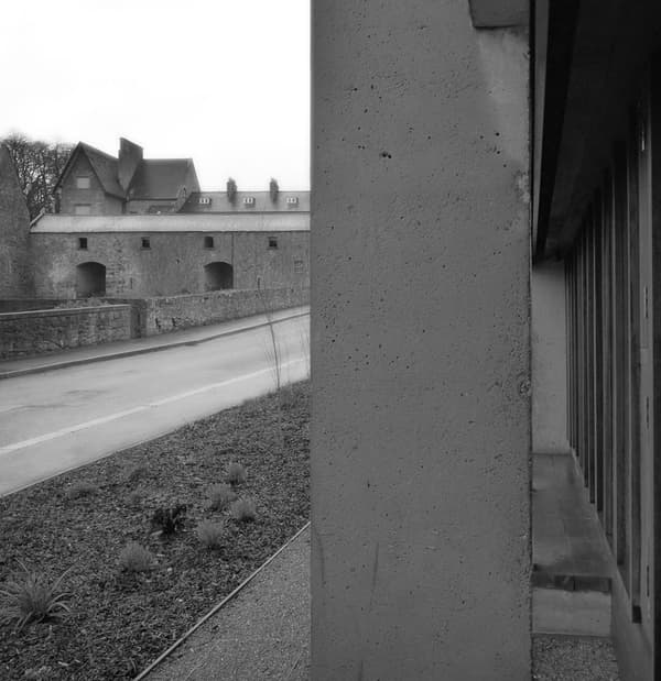 Architectural project - stone facade, industrial facade, concrete texture, concrete facade, historic building, historical architecture, brutalism, brutalist style, urban setting, industrial design, grey tones, outdoor space, contemporary architecture, grey, neutral tones, concrete, natural setting, rural architecture, rustic charm, minimalist design, exterior, adaptive reuse, modern facade, landscape integration, stone, stone wall, rural setting, heritage building, greenery, industrial building, architectural contrast, concrete wall, mixed materials, urban vibe, stone texture
