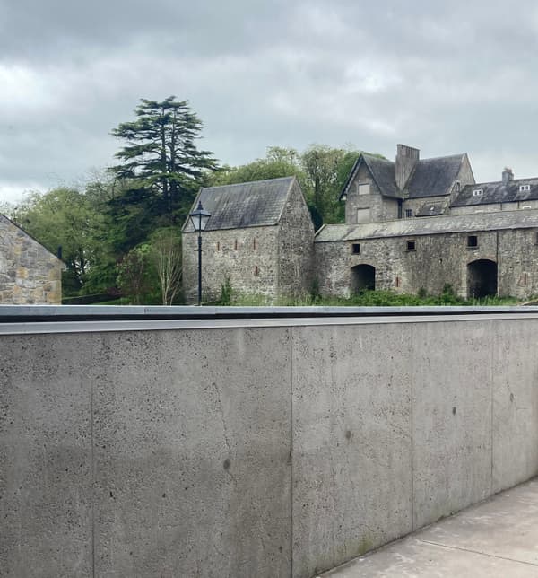 Architectural project - stone facade, scenic backdrop, architectural conservation, heritage preservation, rustic landscape, historic building, cultural heritage, heritage conservation, heritage site, stone building, European style, picturesque view, stone pavement, outdoor space, natural tones, grey, green, rural architecture, rustic charm, green landscape, stone, countryside view, stone wall, rural setting, classic architecture, exterior view, traditional style, serene setting, scenic architecture, timeless design, lush greenery, natural surroundings, stone texture