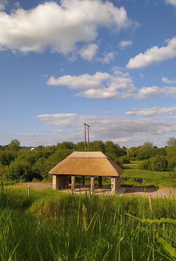 Architectural project - straw, rural landscape, gathering spot, pastoral setting, rural aesthetic, open shelter, scenic beauty, natural materials, sustainable materials, wood, outdoor space, warm tones, eco design, natural setting, minimal structure, outdoor pavilion, earth tones, scenic view, landscape view, rustic design, countryside architecture, environmentally friendly, open pavilion, nature retreat, peaceful retreat, rural setting, country vibe, nature integration, green design, green surroundings, simple architecture