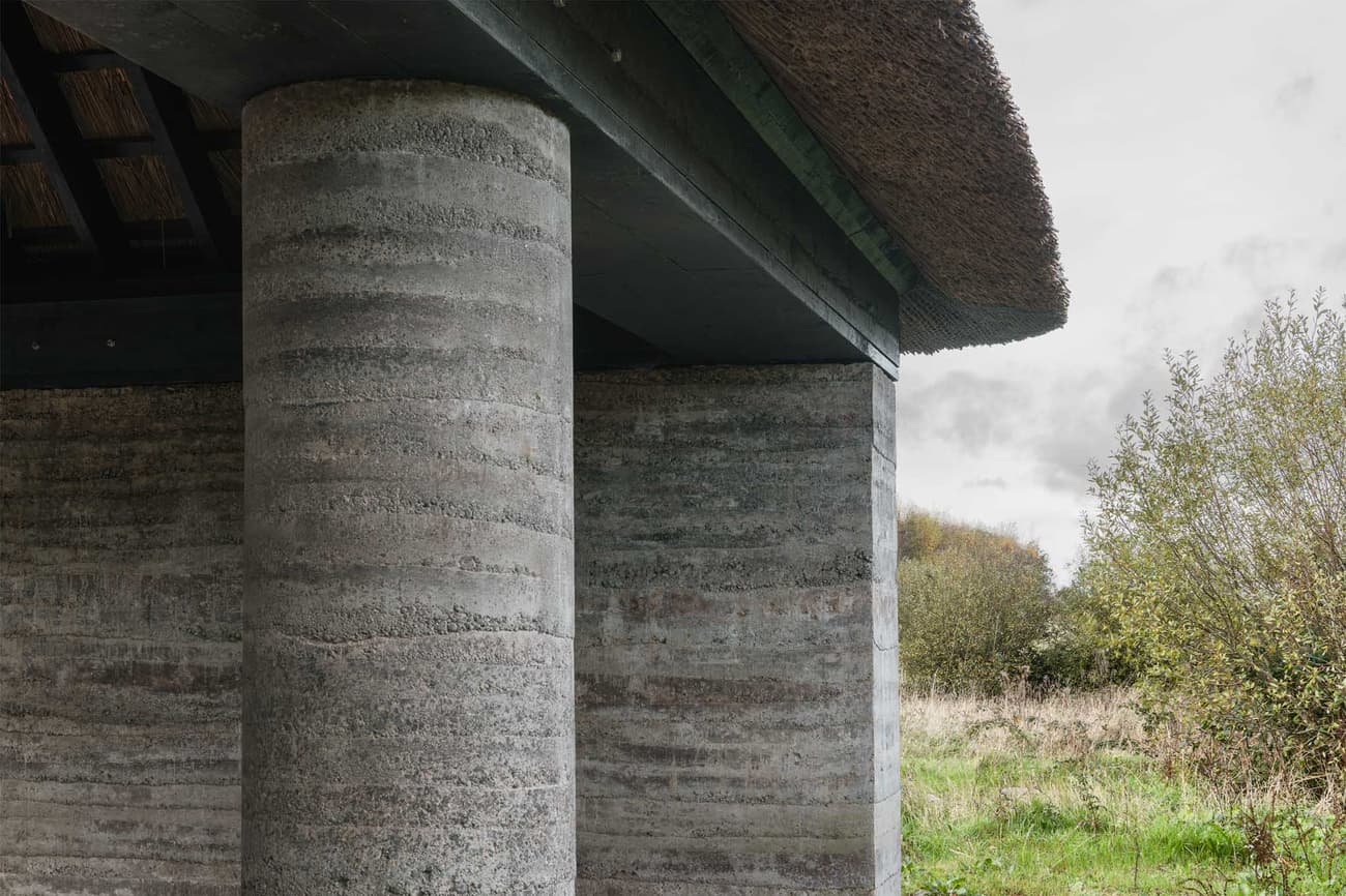 Architectural project - nature-inspired design, integration with nature, earth architecture, rustic elements, pillar, natural materials, architectural detail, passive design, eco design, sustainable construction, grey, exterior design, natural setting, rural architecture, rustic vibe, outdoor, vernacular architecture, exterior, eco building, sustainable building, natural landscape, rammed earth, rammed earth wall, green architecture, low carbon, circular design, countryside home, textured wall, earthy vibe, support structure, earthy tones, traditional design, rustic architecture, countryside building, textured facade, organic textures