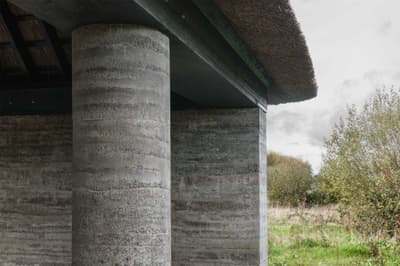 Architectural project - nature-inspired design, integration with nature, earth architecture, rustic elements, pillar, natural materials, architectural detail, passive design, eco design, sustainable construction, grey, exterior design, natural setting, rural architecture, rustic vibe, outdoor, vernacular architecture, exterior, eco building, sustainable building, natural landscape, rammed earth, rammed earth wall, green architecture, low carbon, circular design, countryside home, textured wall, earthy vibe, support structure, earthy tones, traditional design, rustic architecture, countryside building, textured facade, organic textures