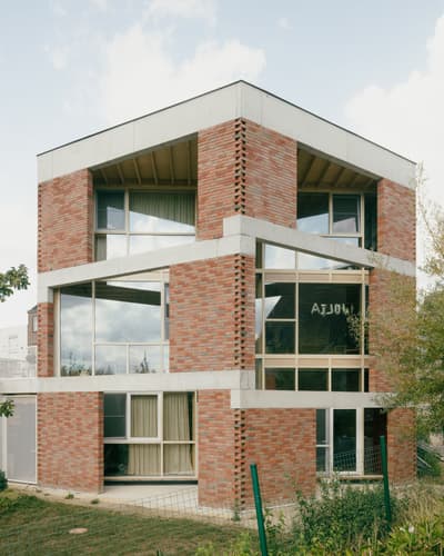 Architectural project - rhythmic pattern, urban dwelling, airy structure, brick exterior, open windows, concrete frame, grey concrete, warm brick, city home, multi-level, urban house, natural materials, natural light, passive design, sustainable design, glass, green building, exposed structure, grey, daylight, beige, concrete, low carbon design, daylight optimization, eco friendly, natural textures, contemporary design, neutral palette, minimalist design, modern facade, clean lines, modern architecture, outdoor view, energy efficient, brick, red brick, garden view, family home, residential building, glass facade, cubic shape, urban living, red