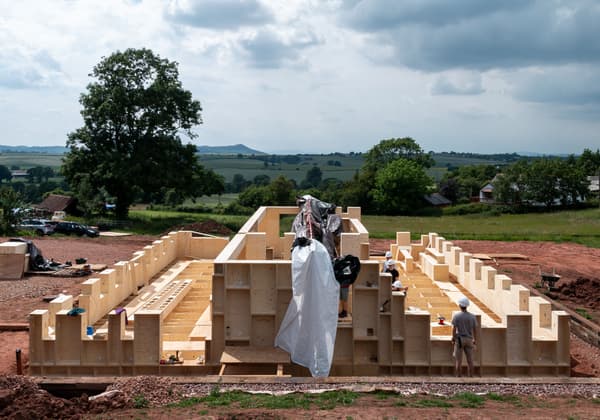 Architectural project - landscape, residential project, timber framework, open ground, site workers, rural environment, spacious area, new build, flat terrain, site foundation, construction layout, natural materials, wood, timber, modular construction, eco design, neutral tones, construction phase, construction site, daylight, construction materials, building site, outdoor setting, beige, brown, natural setting, timber construction, rural architecture, eco materials, wood construction, building process, unfinished building, timber panels, sustainable building, timber walls, wood panels, natural landscape, green architecture, passive house, landscape view, countryside view, low carbon building, structural framework, building development, countryside setting, green field