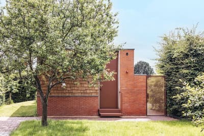 Architectural project - small house, green environment, garden house, green garden, red bricks, modern garden, outdoor path, timber details, natural materials, wood, timber, metal, outdoor living, sustainable design, warm tones, eco design, outdoor area, green, neutral tones, brown, minimalist facade, daylight optimization, natural setting, simple design, passive house, eco friendly home, cozy vibe, inviting entrance, wooden shingles, brick, landscape design, brick facade, backyard retreat, residential architecture, nature integration, shingle cladding, secluded home, rustic exterior, private garden, peaceful atmosphere, modern exterior, earthy colors, garden space, red