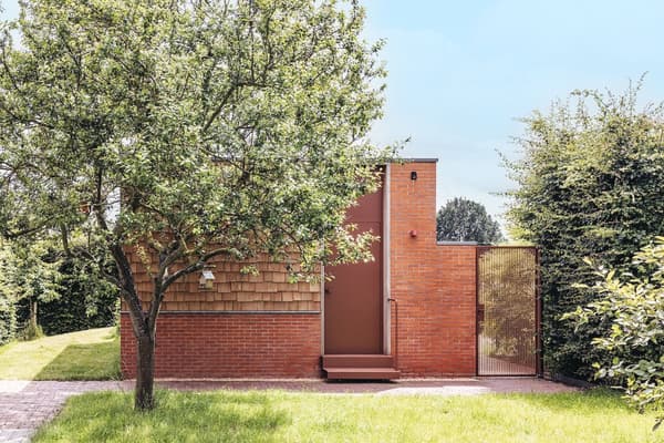 Architectural project - small house, green environment, garden house, green garden, red bricks, modern garden, outdoor path, timber details, natural materials, wood, timber, metal, outdoor living, sustainable design, warm tones, eco design, outdoor area, green, neutral tones, brown, minimalist facade, daylight optimization, natural setting, simple design, passive house, eco friendly home, cozy vibe, inviting entrance, wooden shingles, brick, landscape design, brick facade, backyard retreat, residential architecture, nature integration, shingle cladding, secluded home, rustic exterior, private garden, peaceful atmosphere, modern exterior, earthy colors, garden space, red
