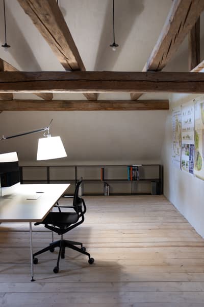 Architectural project - attic conversion, cozy office, light wood floor, quiet space, eco friendly office, attic office, loft workspace, minimalist desk, black chair, desk lamp, rustic office, simple shelving, office nook, small office, natural materials, pastel tones, wood, timber, steel, natural light, sustainable design, warm tones, neutral tones, exposed beams, functional space, daylight, wooden ceiling, beige, light wood, timber beams, rustic modern, Scandinavian style, black, wood floor, modern rustic, clean lines, white walls, white, cozy vibe, Nordic style, plaster, compact design, open shelves, home office, study area, work from home, bright space, wooden textures, plaster walls, airy atmosphere