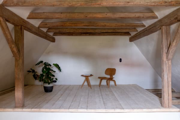 Architectural project - natural elements, hygge, potted plant, attic conversion, loft space, plant decor, attic space, loft conversion, minimal living, wooden chair, cozy loft, rustic attic, designer chair, accent chair, side table, relaxation space, natural materials, wood, timber, natural light, sustainable design, warm tones, natural tones, exposed beams, beige, light wood, eco friendly, wooden beams, rustic vibe, rustic modern, Scandinavian style, timber floor, wooden floor, serene space, modern rustic, biophilic design, white walls, white, Nordic design, cozy vibe, plaster, minimalist decor, simple living, cozy corner, greenery, reading nook, bright space, calm atmosphere, simple decor, small table, plaster walls